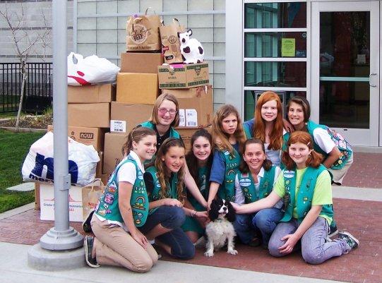 Girl Scouts dropping off donations